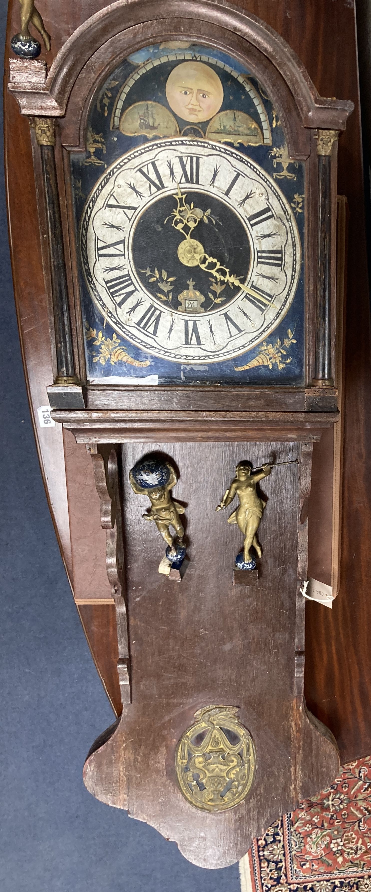 A wall clock with painted dial, height 132cm